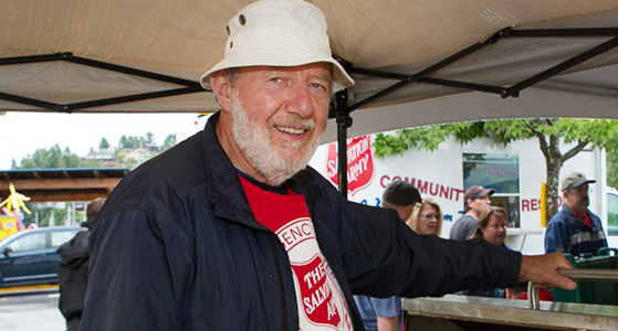 Volunteer smiling at the camera