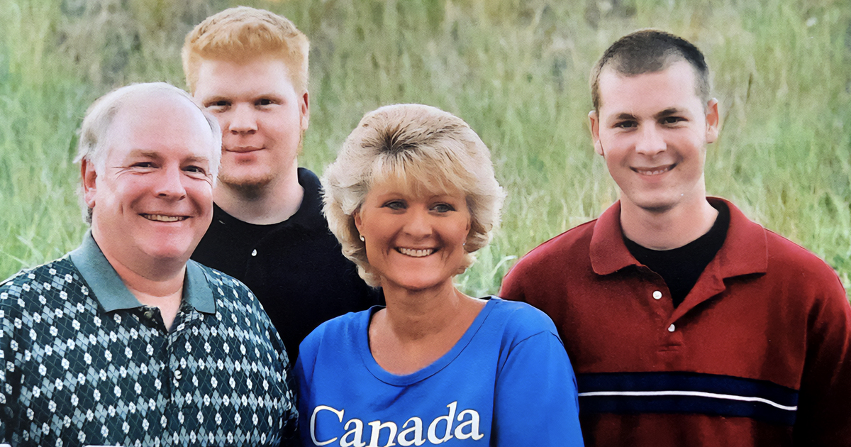 Smiling family photo: mom, dad and two sons