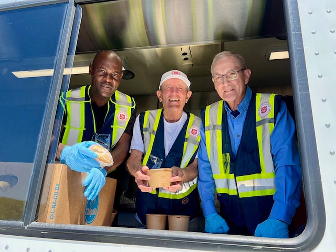 a group of volunteers smiling at the camera